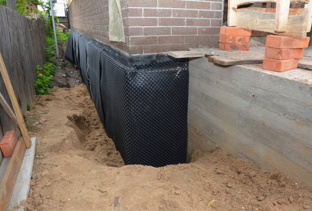 SJ Waterproofing Pros technician performing targeted Foundation Crack Repair assessment in Cassopolis, MI